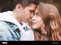 teen-boy-and-girl-15-16-year-old-looking-at-each-other-closeup-relationship-autumn-season-happ...jpg